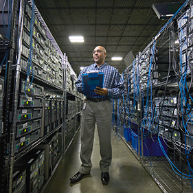 IM employee evaluating data servers for decommission